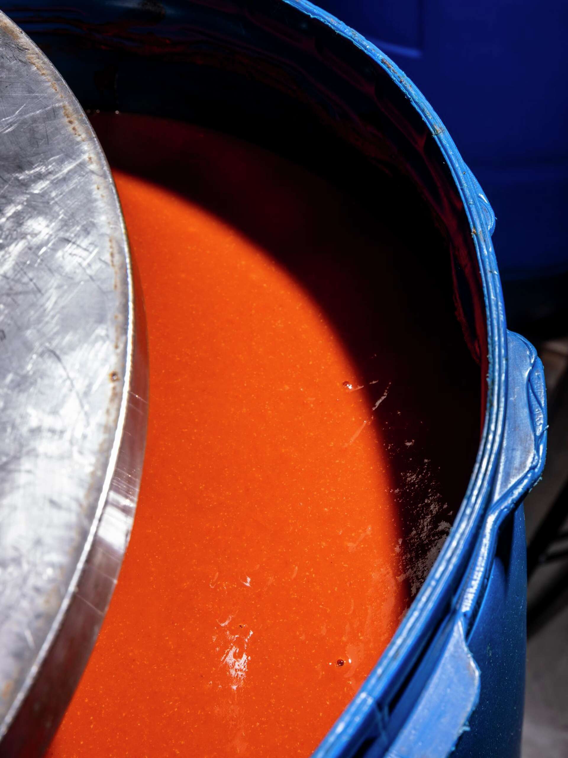 A drum of fresh chili sauce